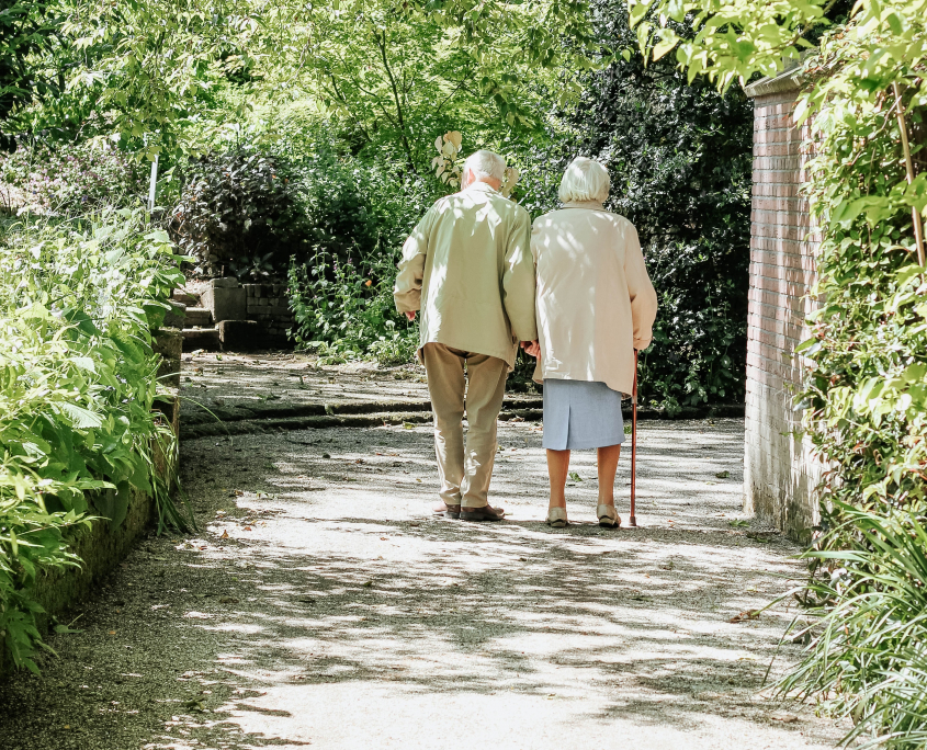 man and woman walking on road during daytime